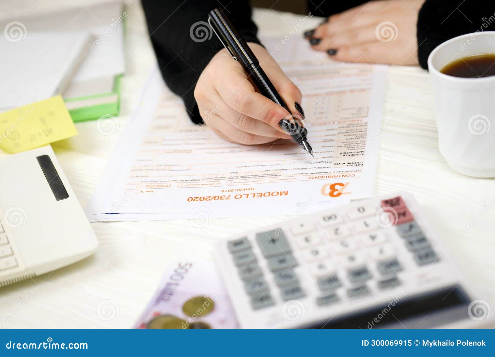 accountant fill italian tax form modello 730 individual income tax return in end of tax period. taxation and paperwork