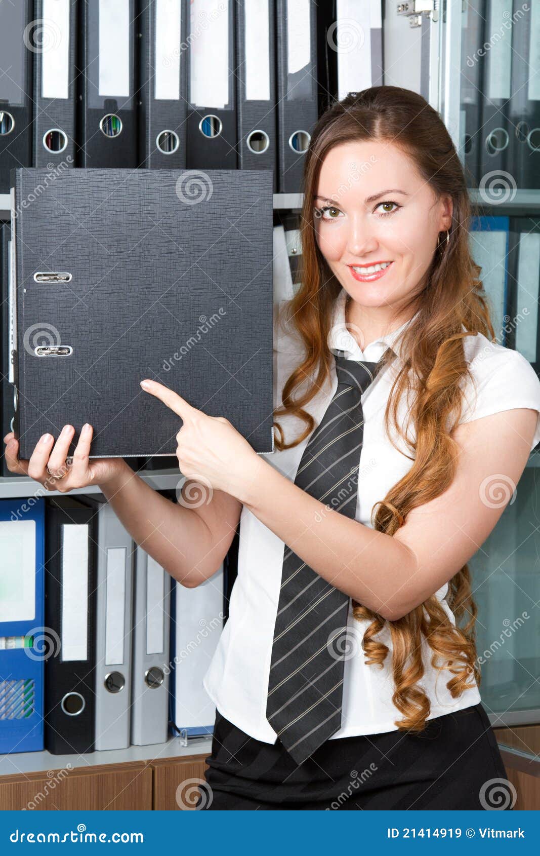 accountant points his finger at the folder