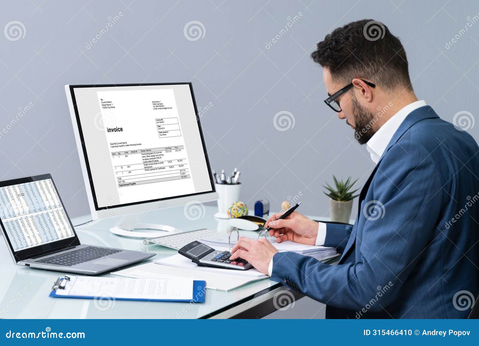 accountant using computer to manage invoices