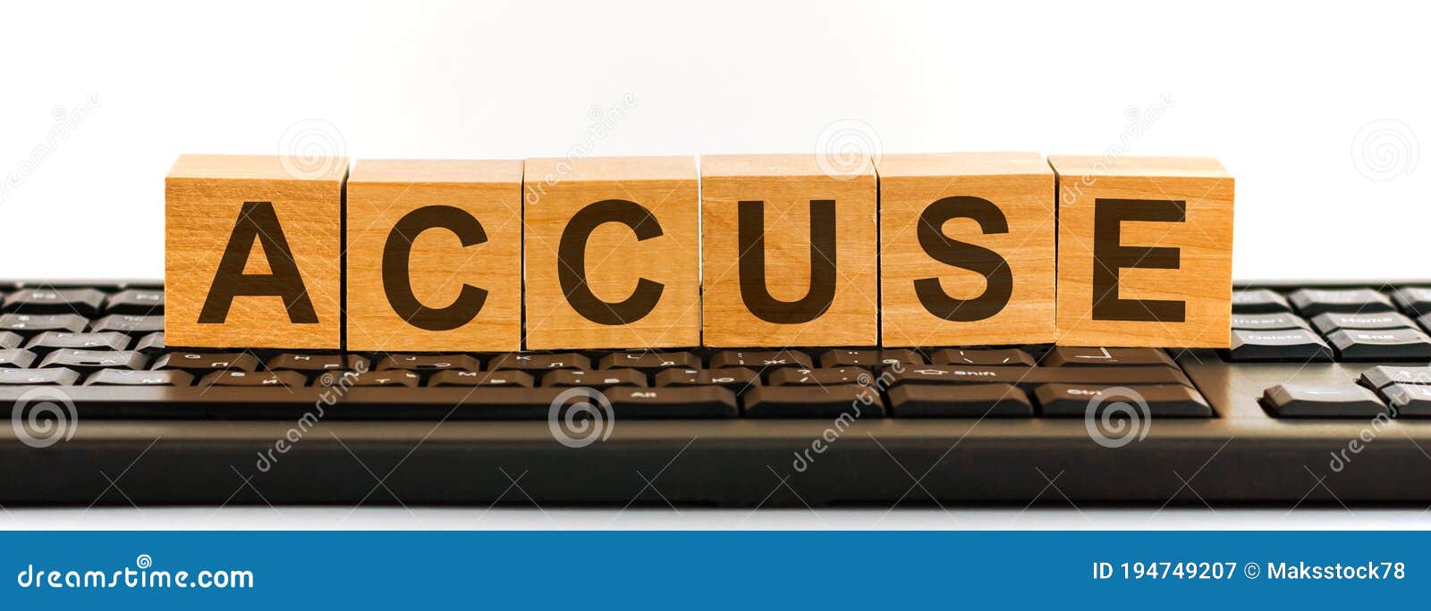 accuse word made with building blocks jn the black keyboard