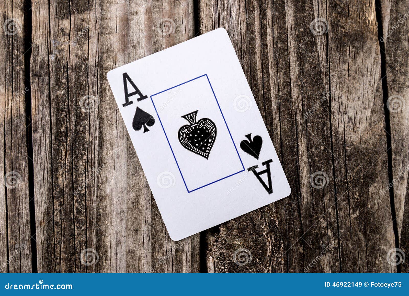 ace of spades card on wood