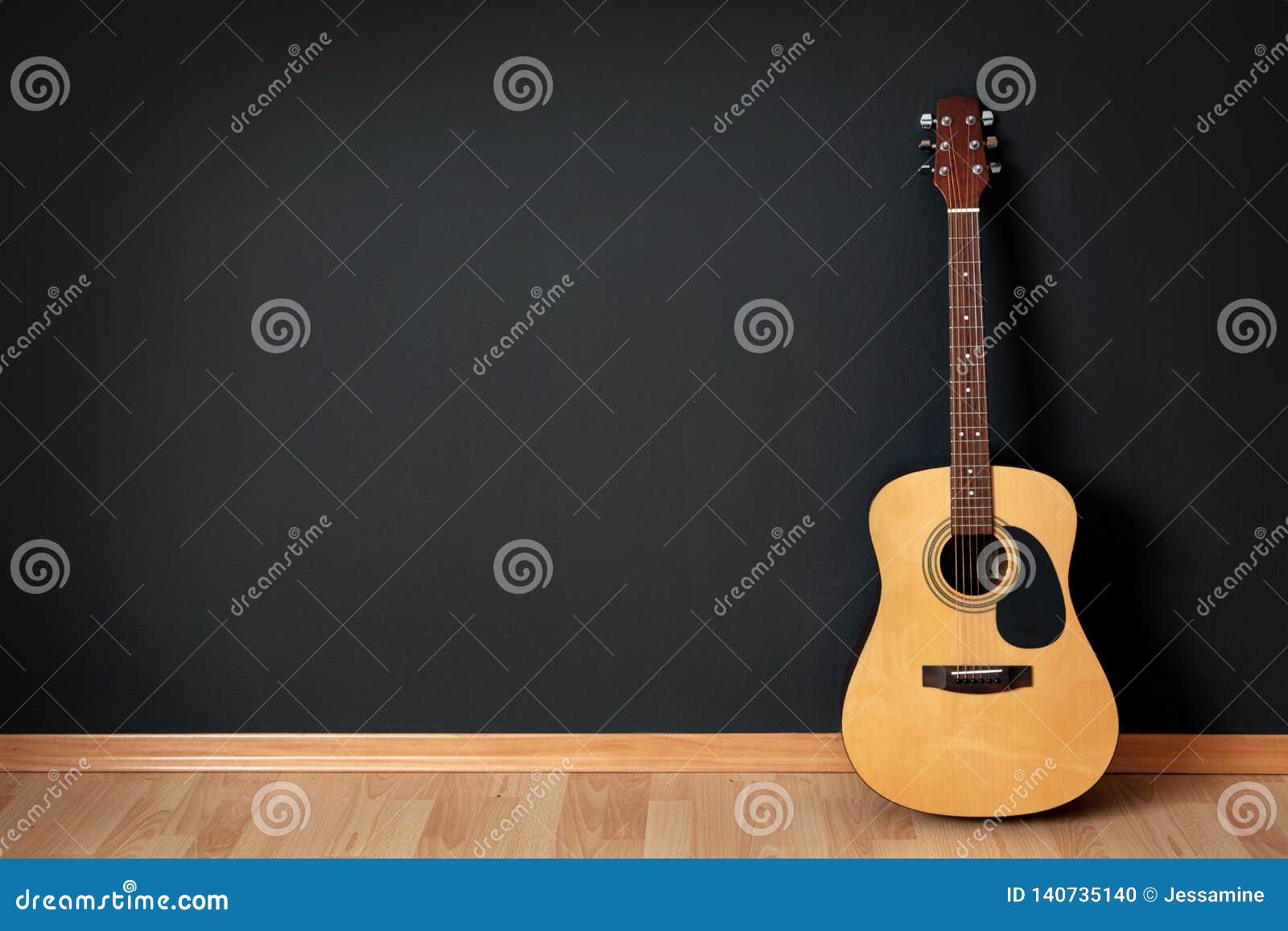 acoustic guitar in empty room