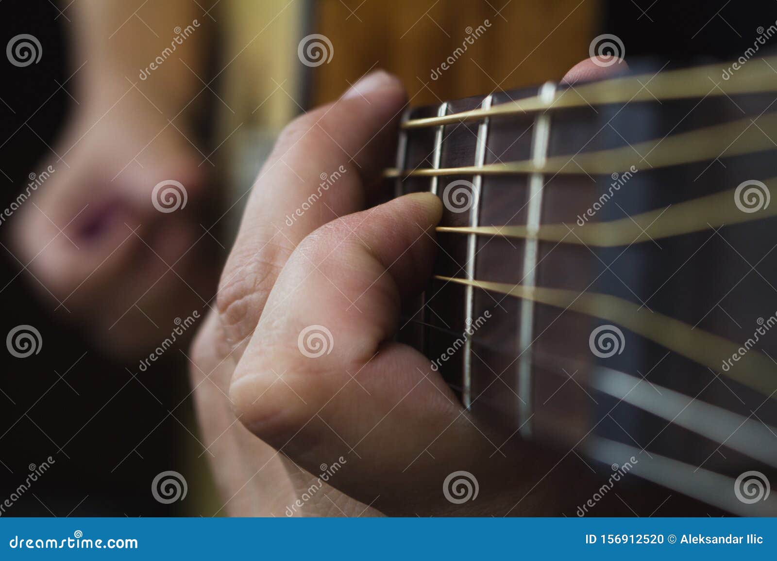 Acoustic Guitar Player Performing. Guitarist Playing in Music Studio