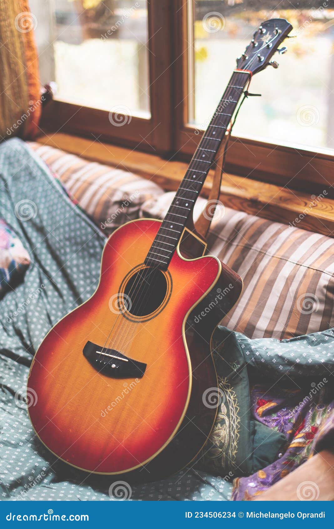 Acoustic Guitar Resting on a Sofa_2 Stock Photo Image of music, rest