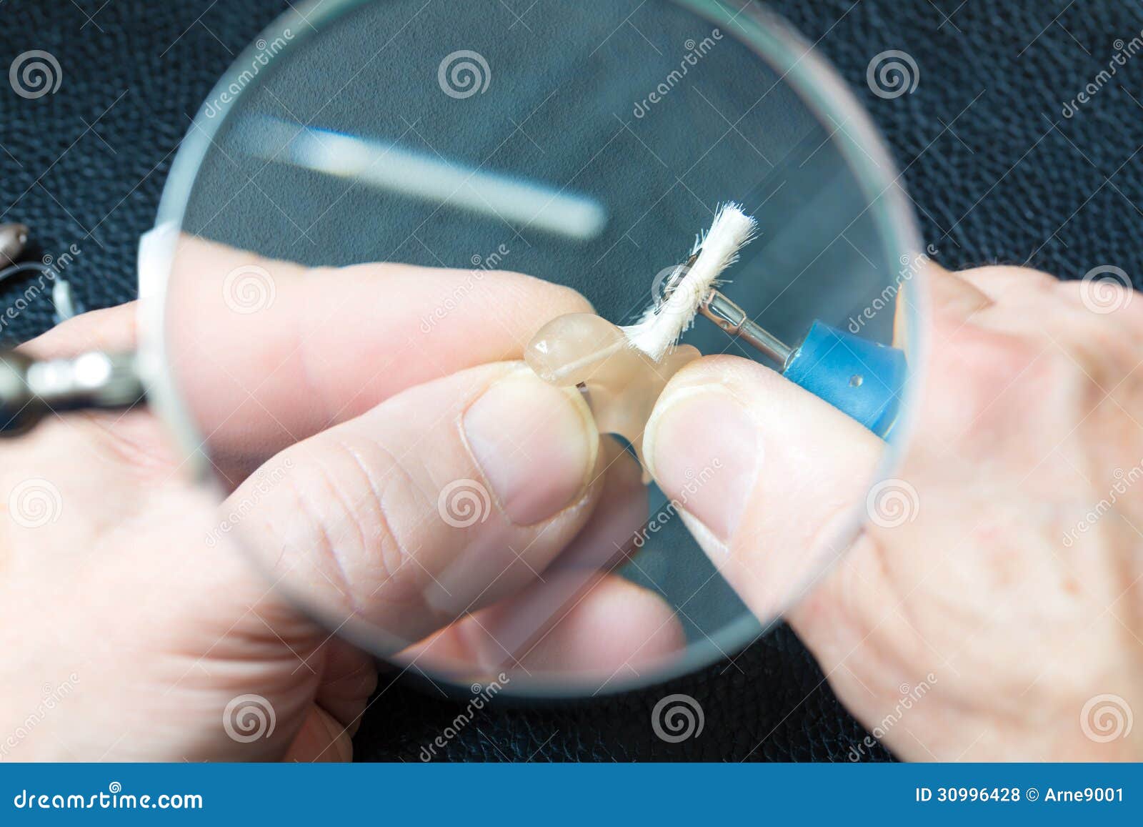 Acoustician Working on a Hearing Aid Stock Photo Image of life, magnifier 30996428