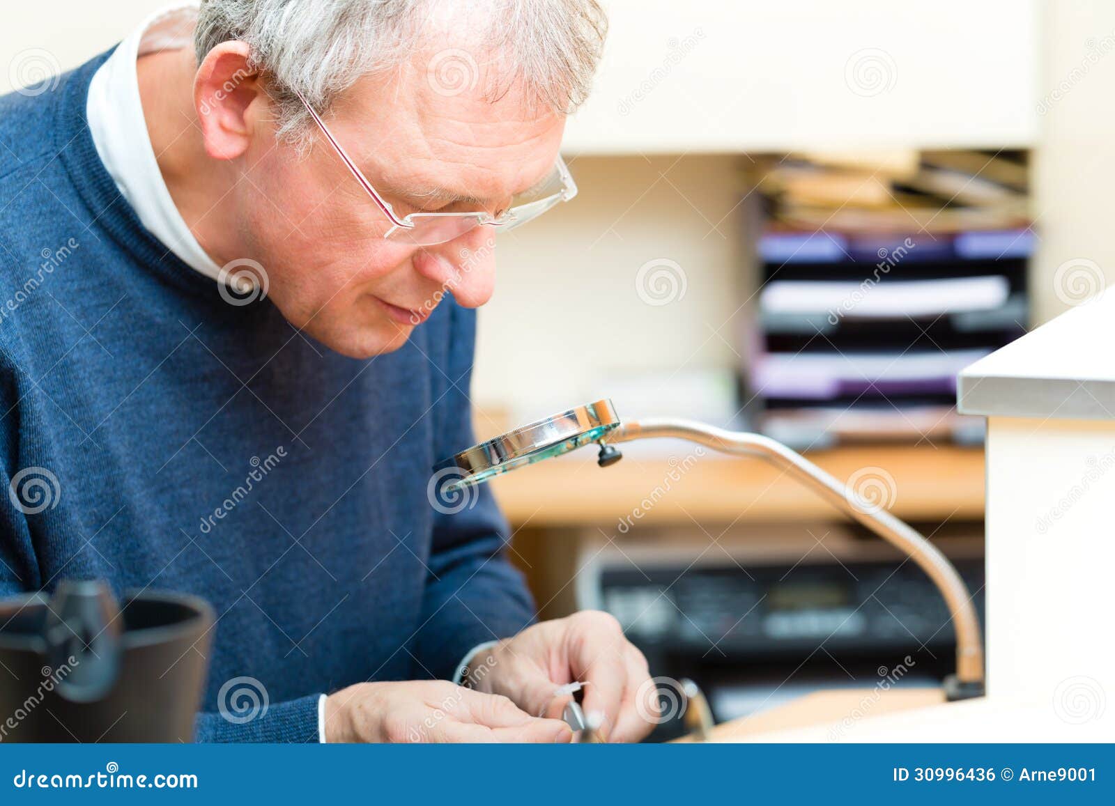 Acoustician Working on a Hearing Aid Stock Photo Image of acoustician, senior 30996436