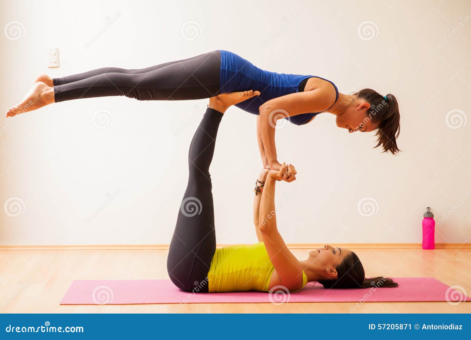 Acrobatic yoga in a gym stock image. Image of space, acrobatic - 57205871