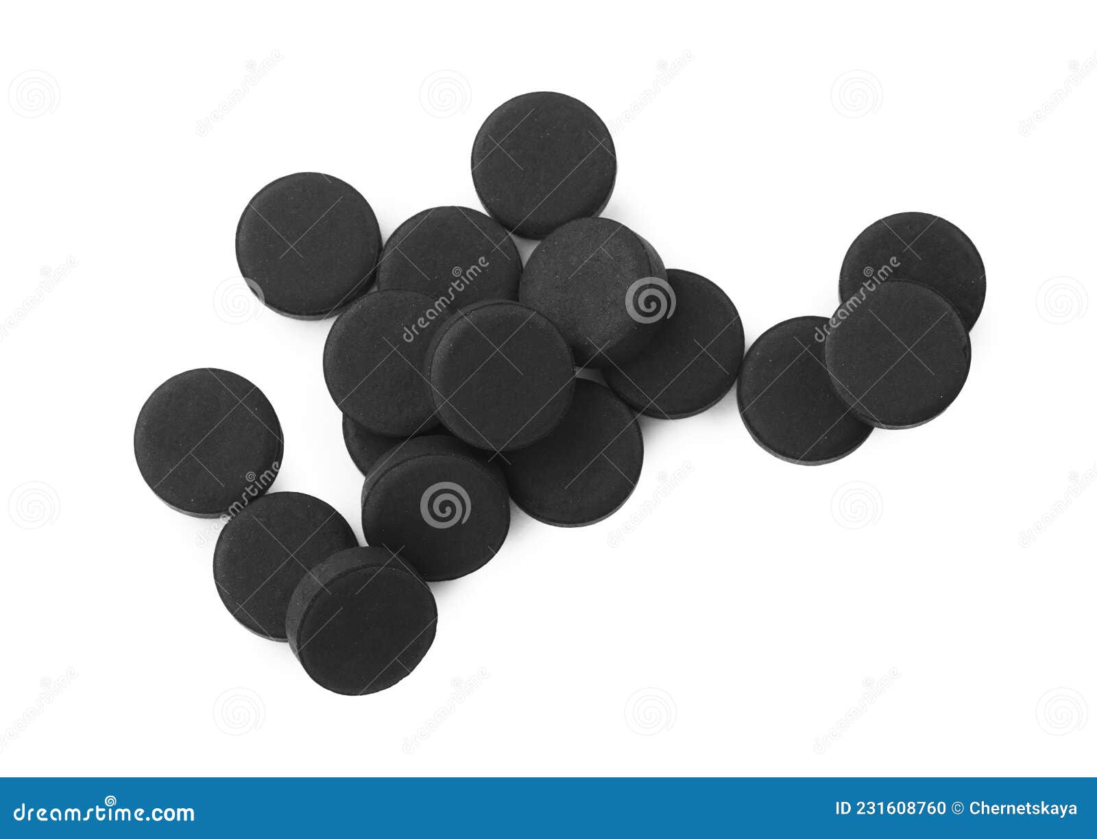 activated charcoal pills on white background, top view. potent sorbent