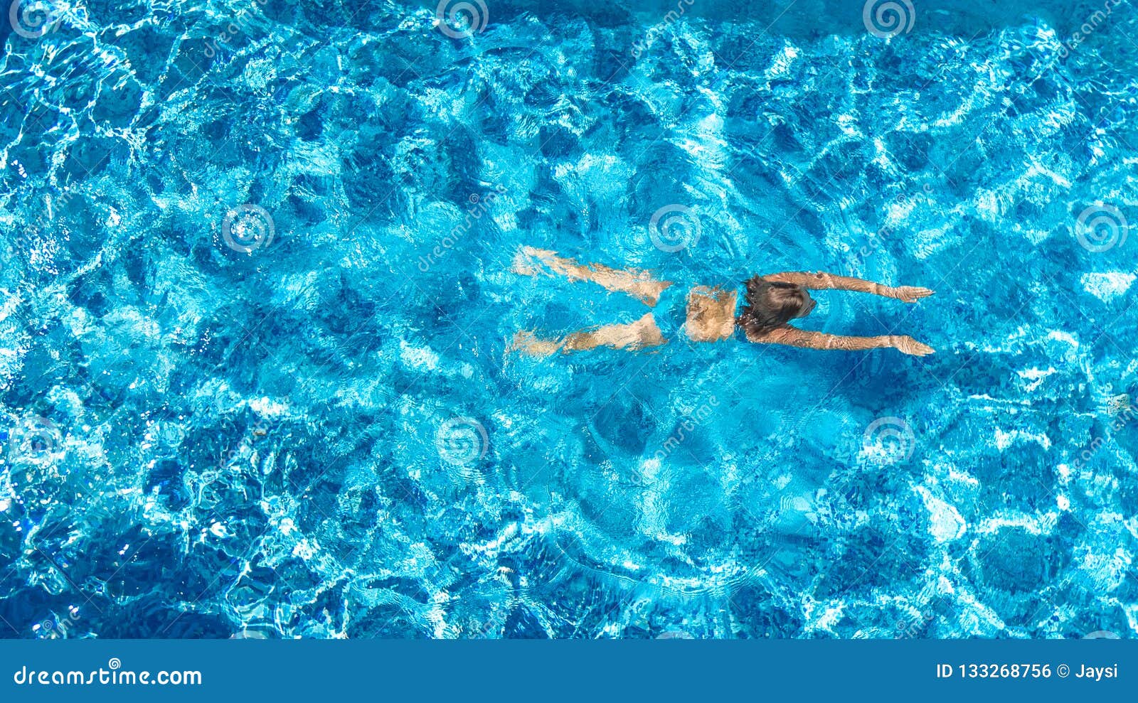 Boy Teen In Goggles Swims Under Water And Waves Hand In 
