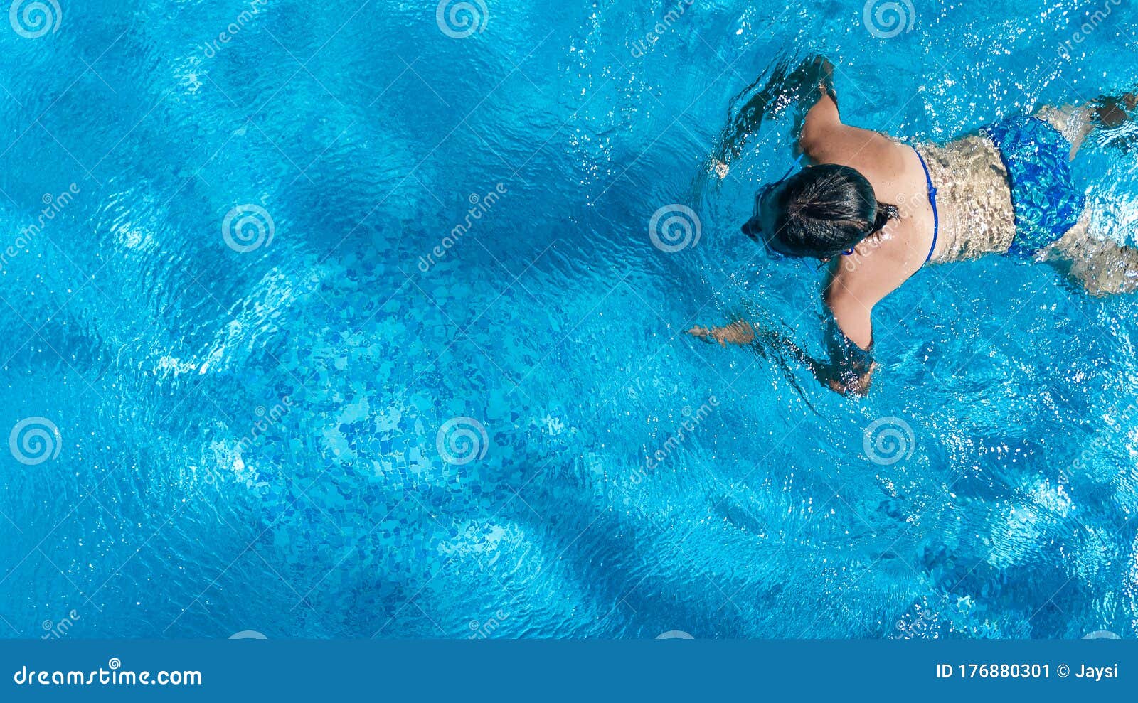 Little Girl Active Swim In The Blue Pool Face Down, View 