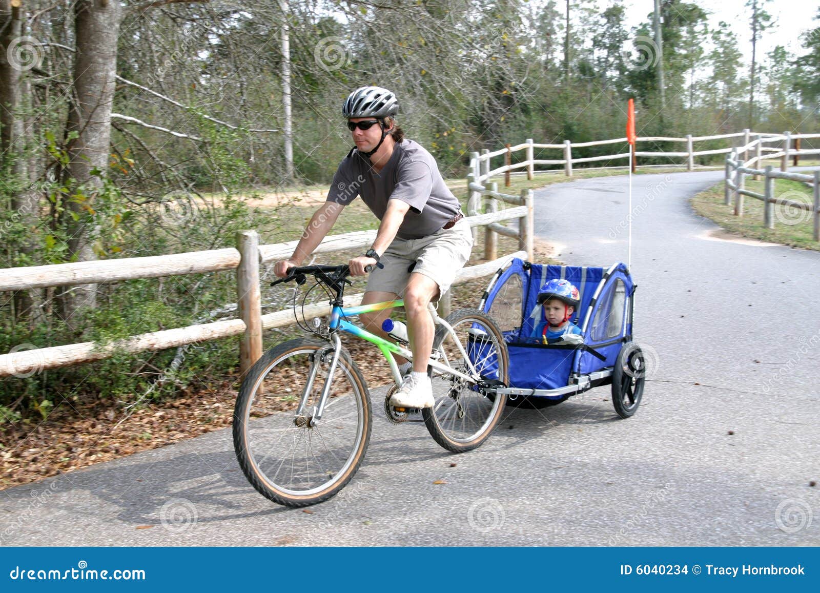 Active Man Pulling Son on Bike Stock Photo Image of relaxation