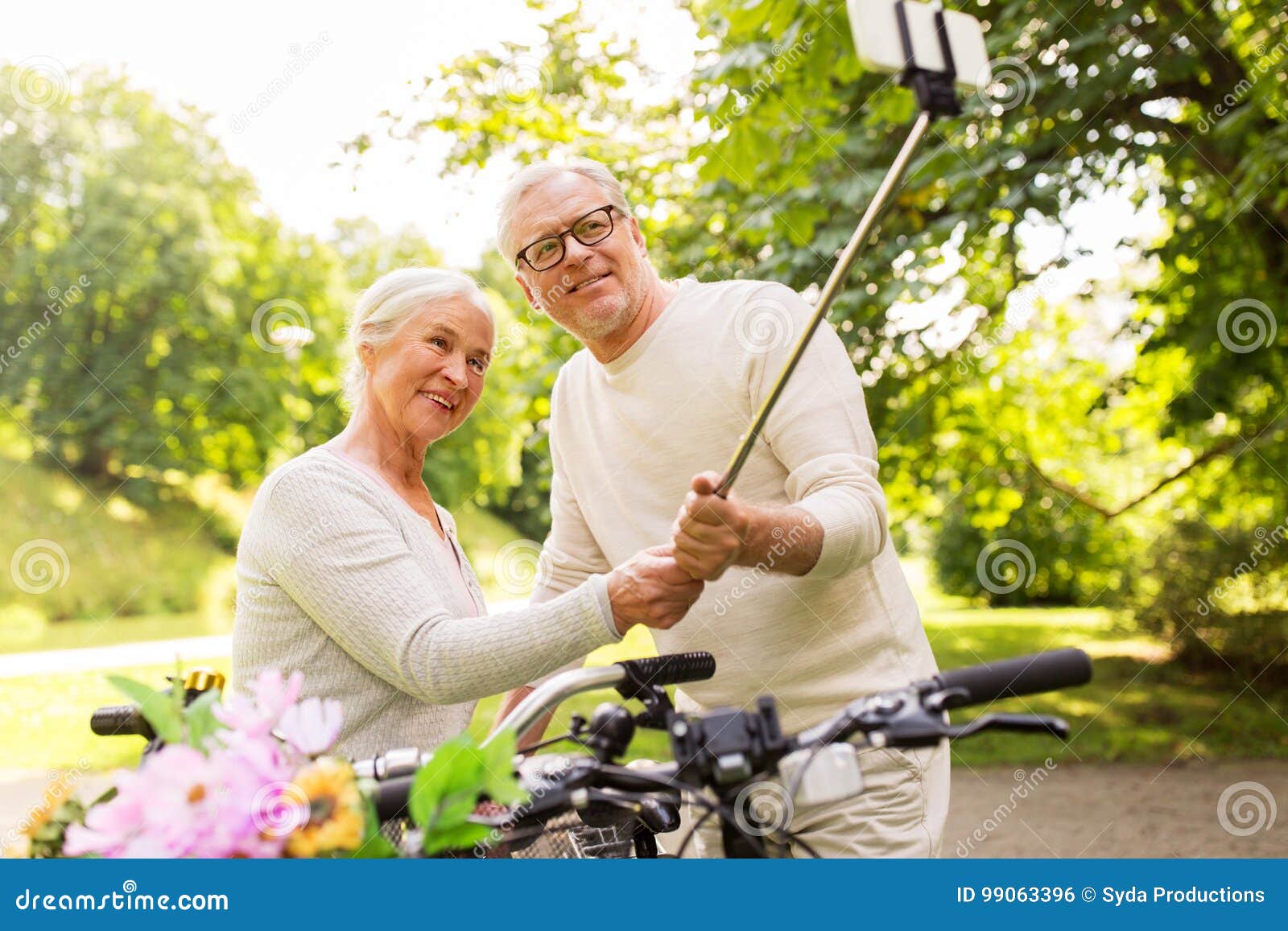 Senior Couple With Bicycles Taking Selfie At Park Stock Photo Image