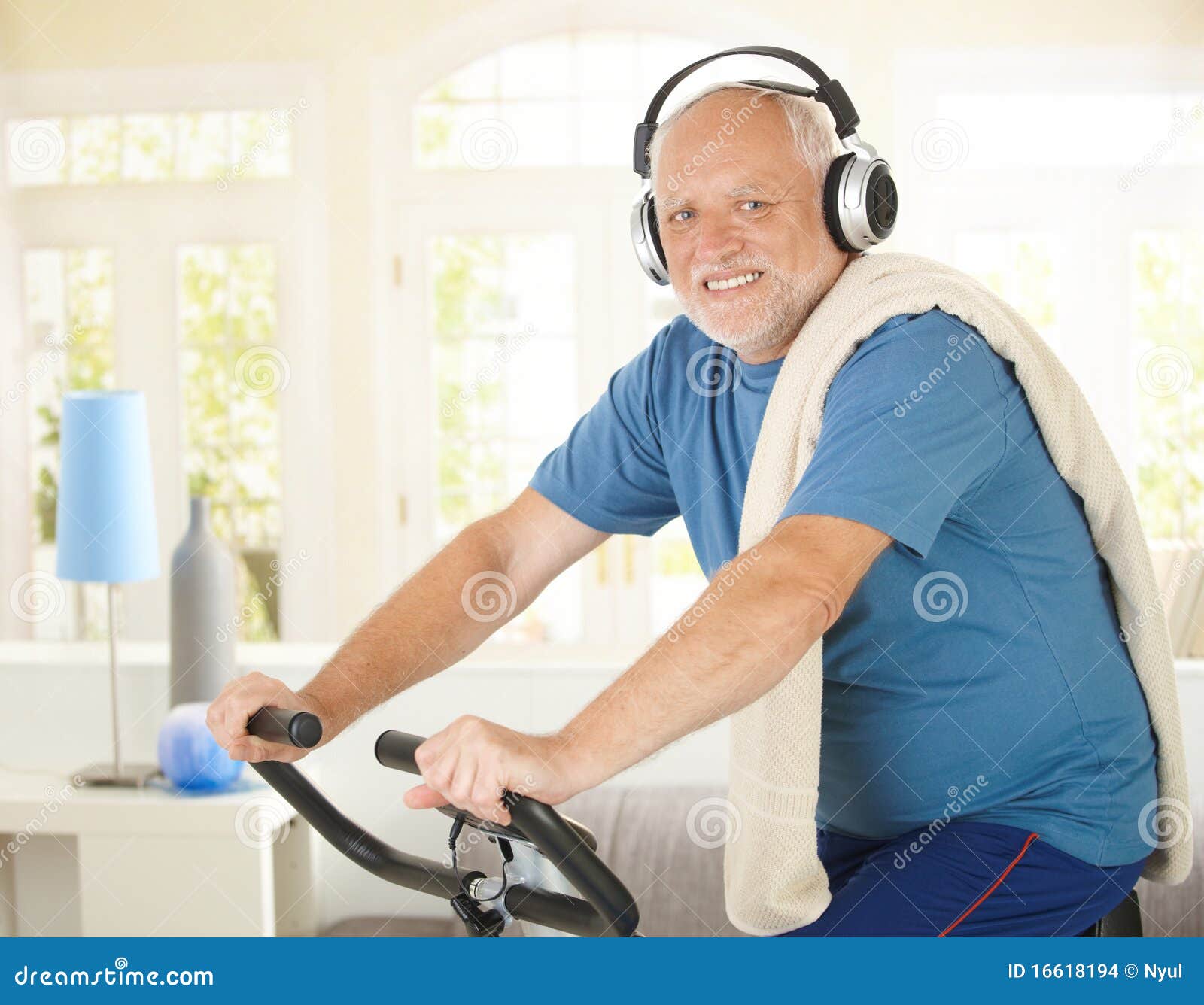 active pensioner doing spinning with music