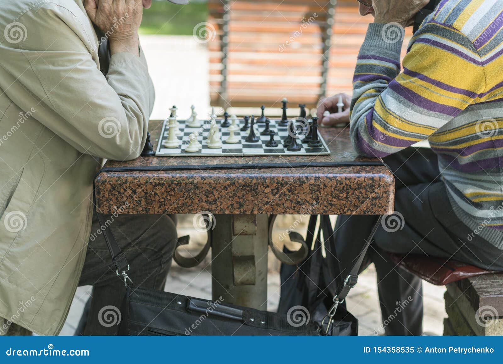 Two zoomers play the old game of chess 