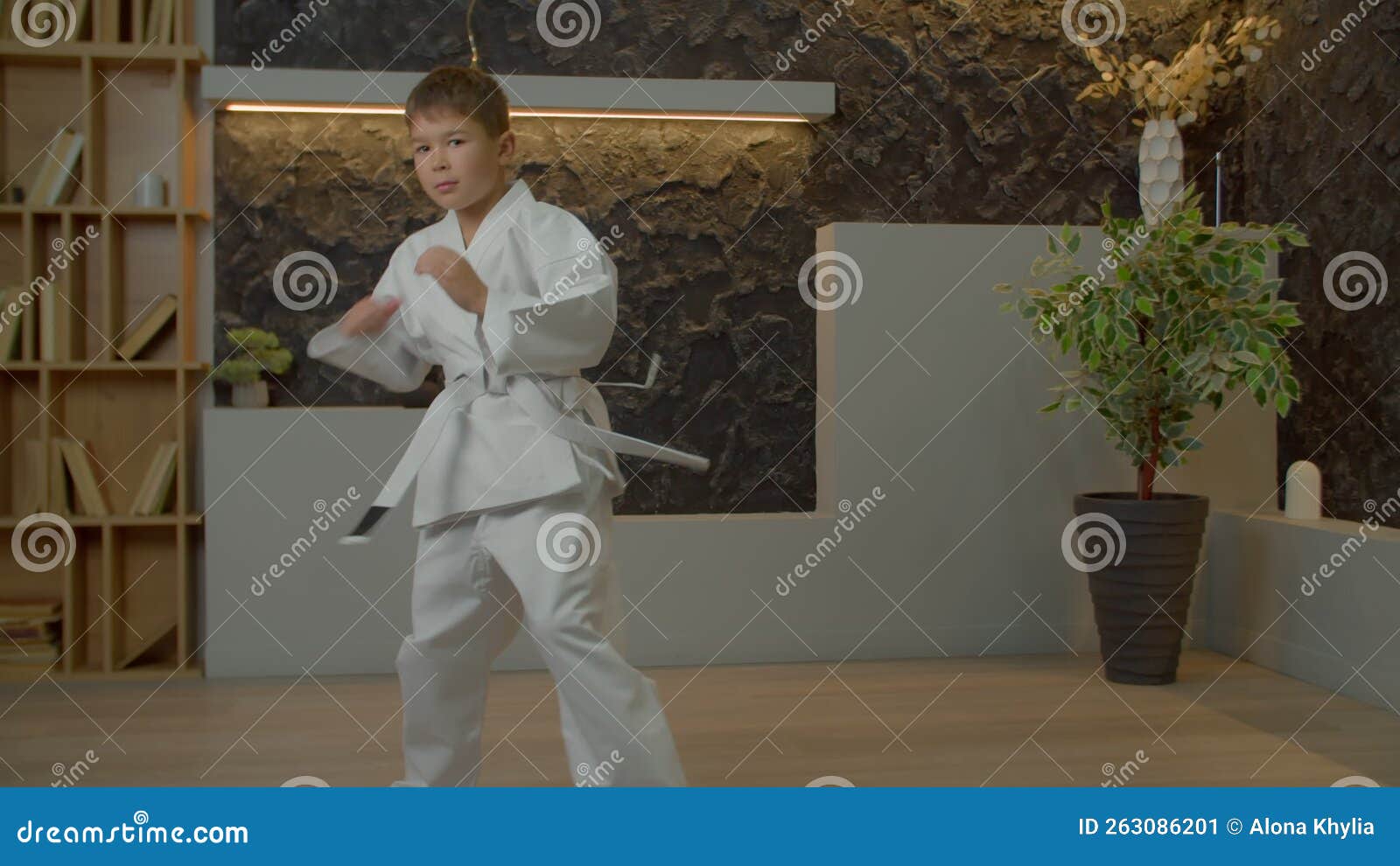 Active School Age Multiracial Kid Doing Karate Kick Combination during