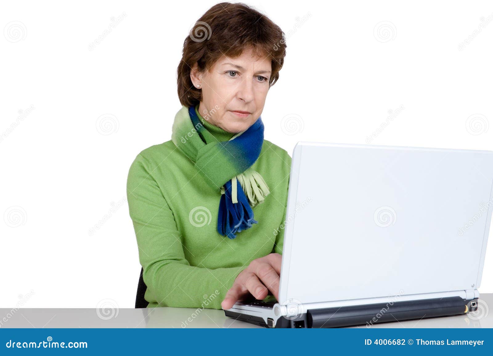 Active senior woman. Senior woman is working with a notebook. Full isolated studio picture