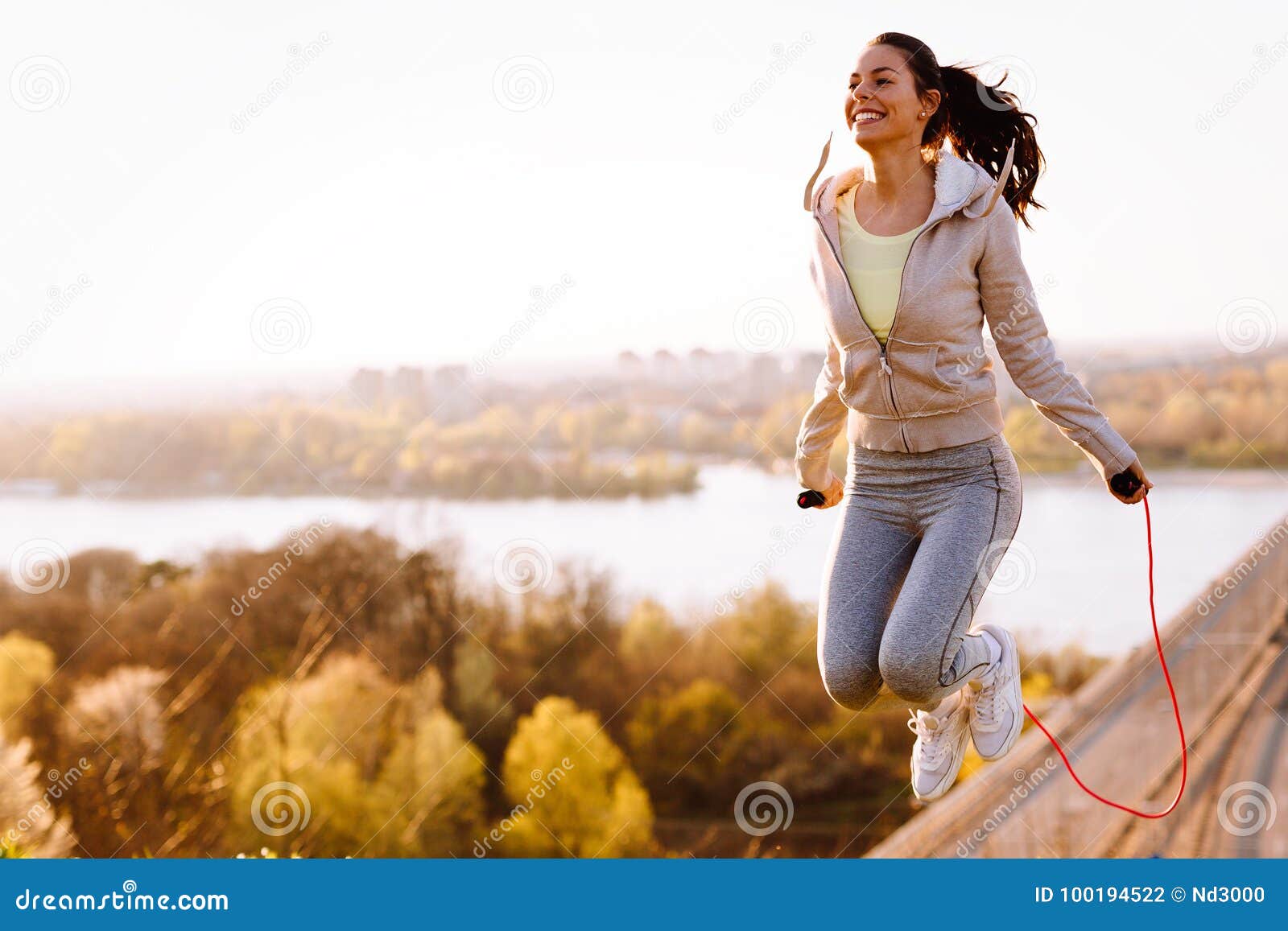 Active Woman Jumping with Skipping Rope Outdoors Stock Photo - Image of
