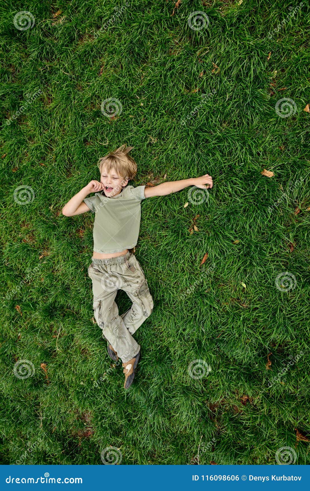 Boy resting on grass stock photo. Image of comfort, childhood 116098606