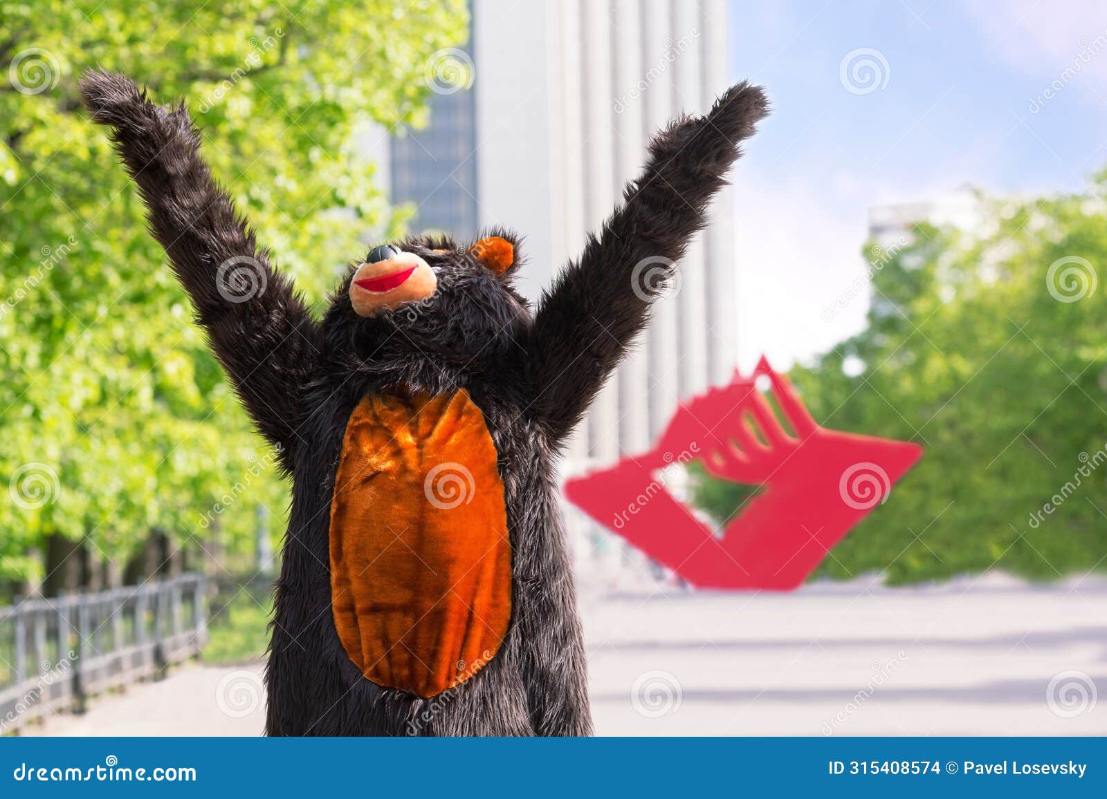 actor dressed as bear enjoys the sun on avenue of