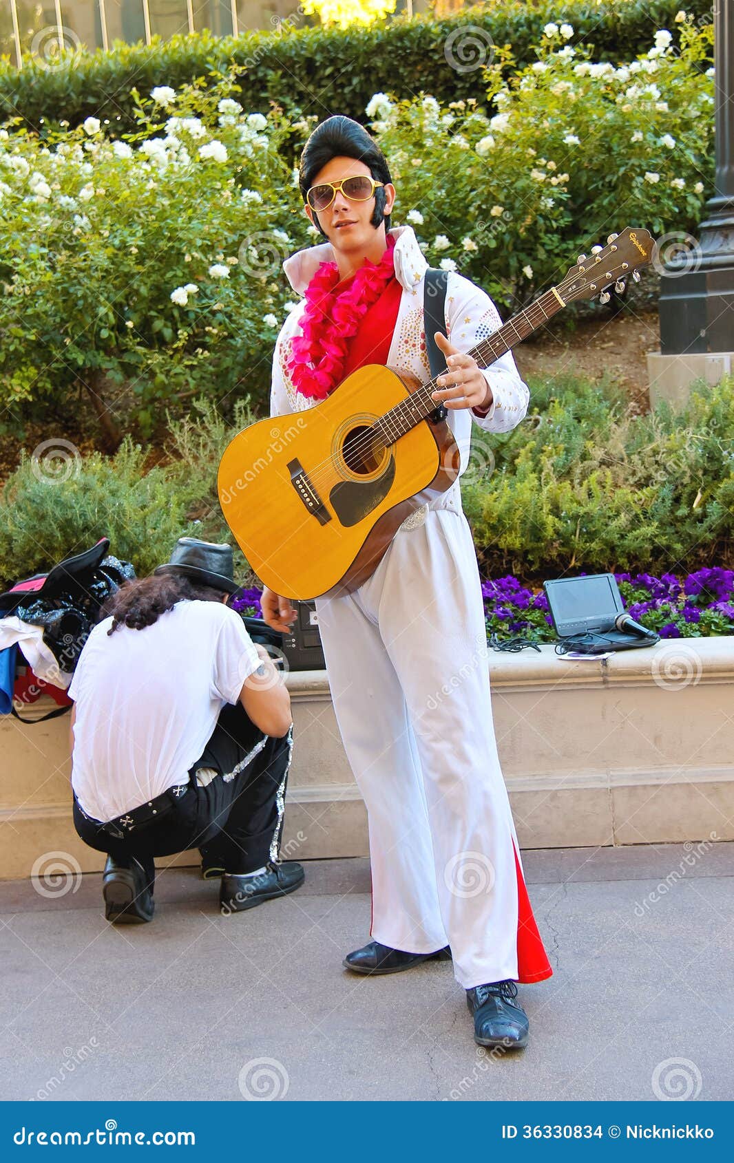 Beautiful Girl Posing Near A Black Guitar Stock Photo, Picture and Royalty  Free Image. Image 59130157.