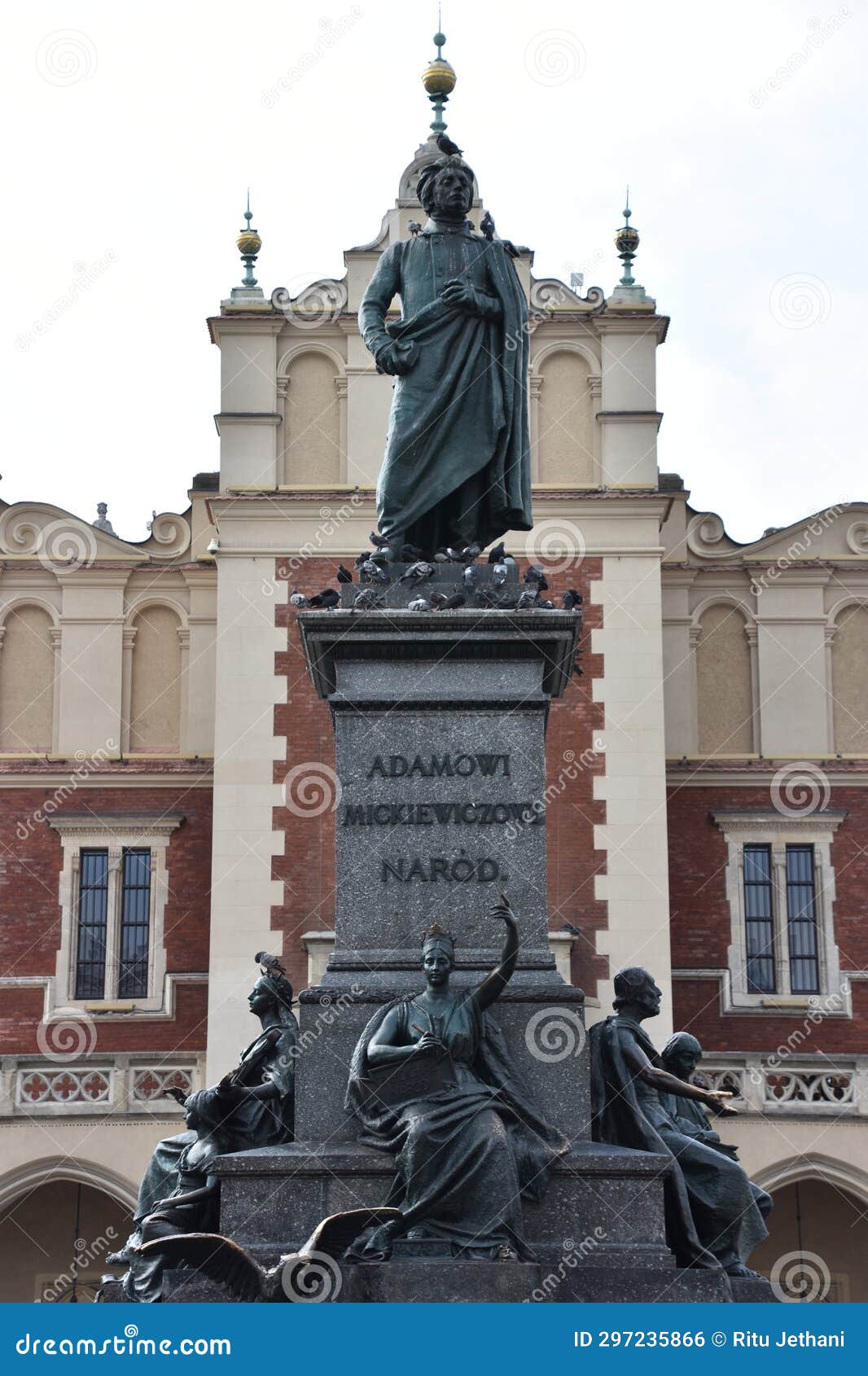 adam mickiewic monument at main market square in krakow, poland