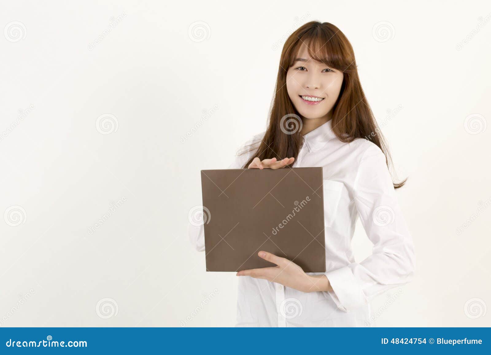 Add your message. Young Asian Woman Holding a Blank Brown Sign