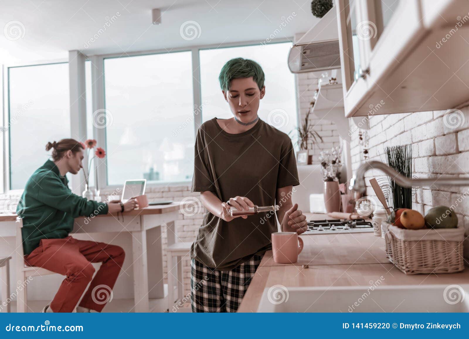 Addicted Girlfriend Secretly Adding Alcohol To Her Coffee Stock Photo
