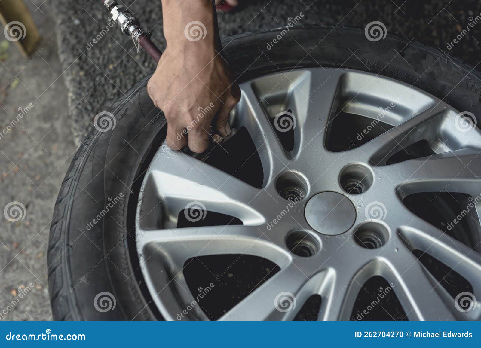 Adding Air Pressure into a Newly Vulcanized Tire. Attaching an Air Hose into the Valve Stem