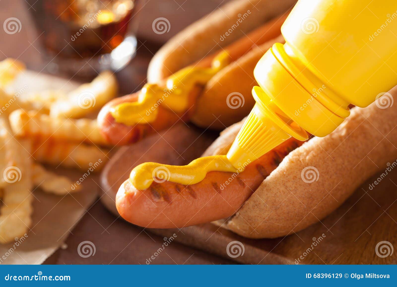 Adding Mustard To Grilled Hot Dog Stock Image Image of bread, glass