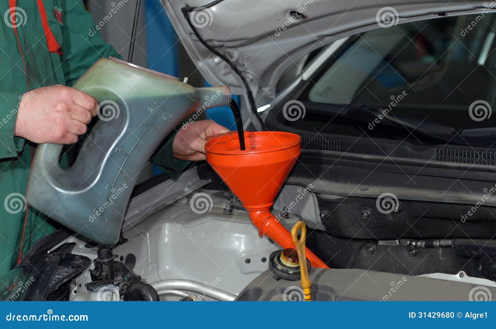 adding oil to a car