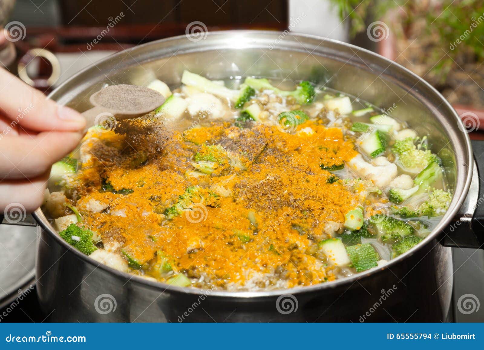 Adding Spices To Vegetable Soup Stock Photo Image of grain, hand