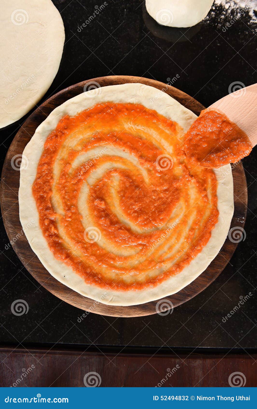 Adding Tomato Sauce To Pizza Base Stock Photo Image of person