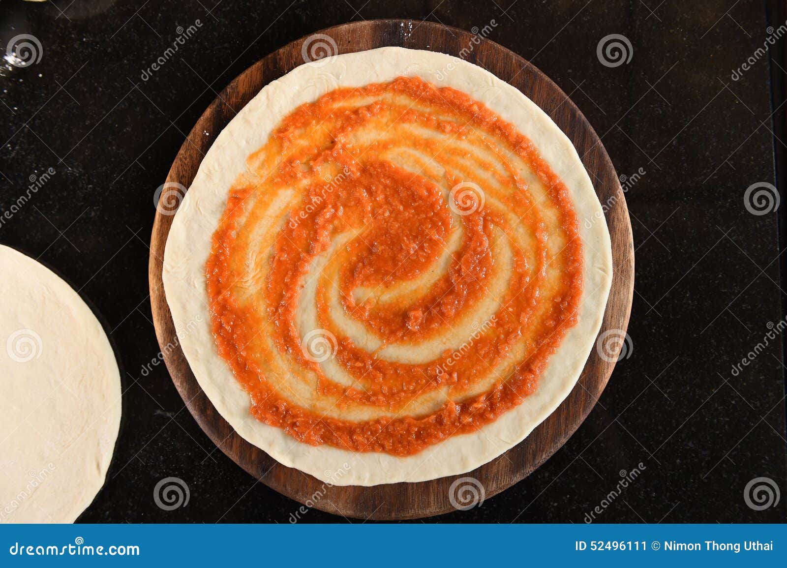 Adding Tomato Sauce To Pizza Base Stock Image Image of horizontal