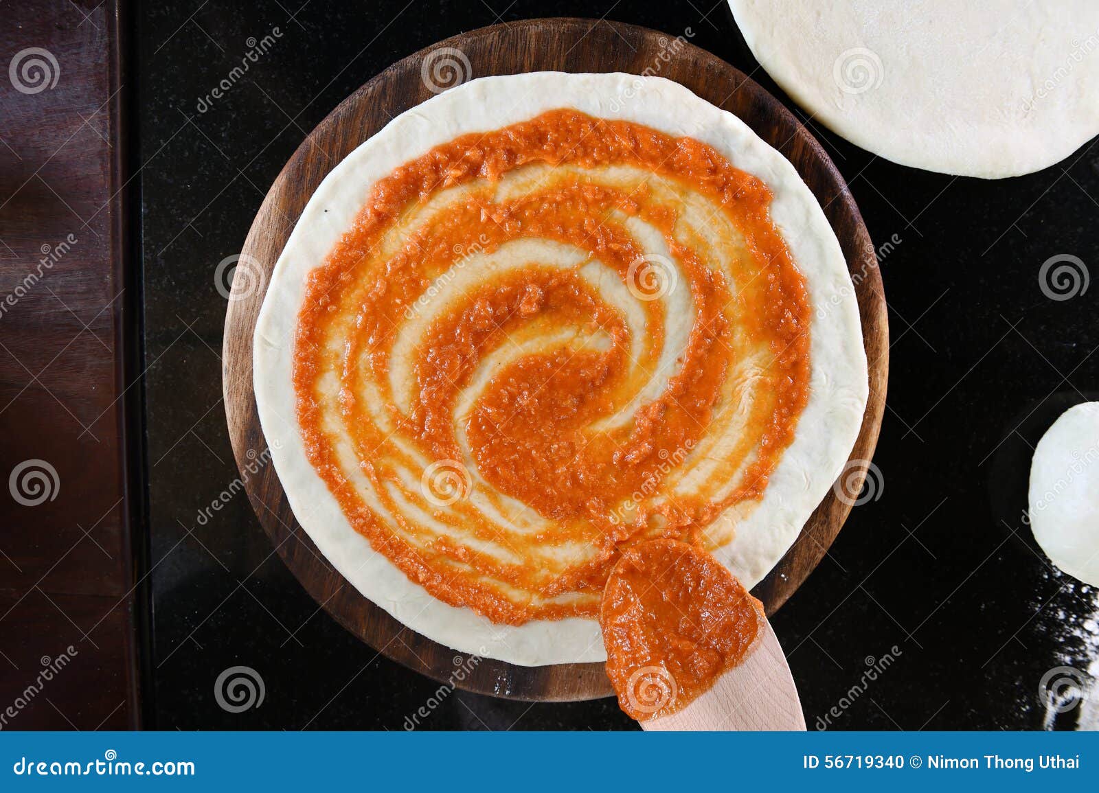 Adding Tomato Sauce To Pizza Base Stock Photo Image of close