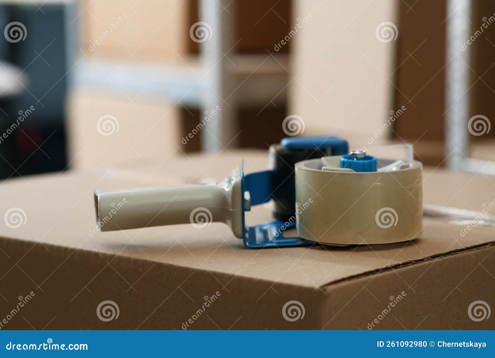 Adhesive Tape Dispenser on Cardboard Box Indoors Stock Photo Image of