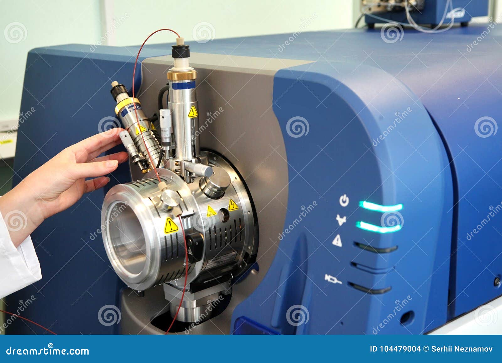 adjust the mass spectrometer. the man analyzes the device for de