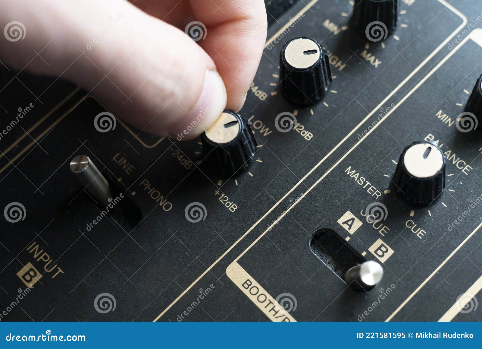 The Adjust the Volume Control Knob of the Sound Music Speakers Stock