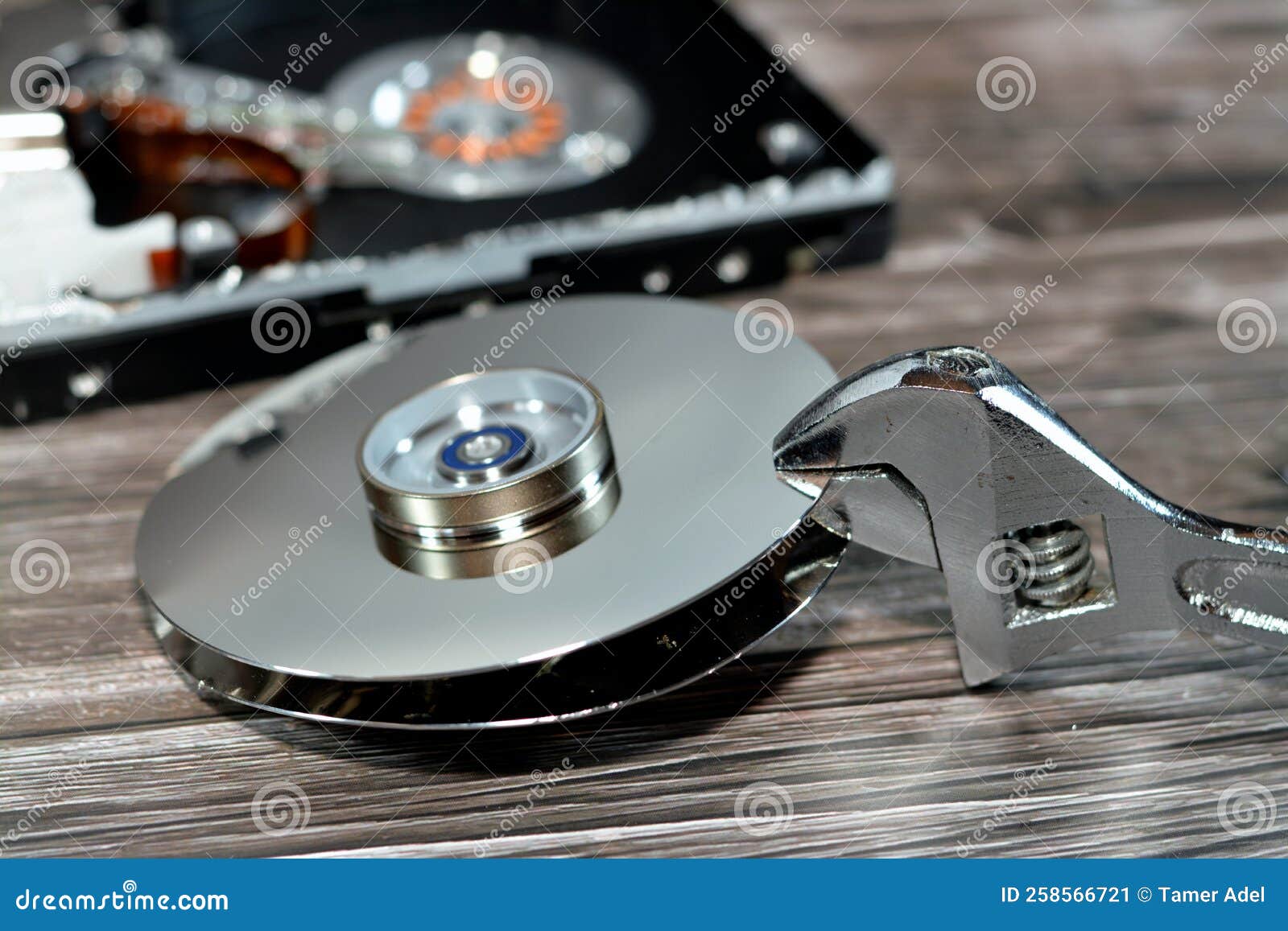 An Adjustable Spanner Wrench and HDD Platters Together, Hard Disk Drive