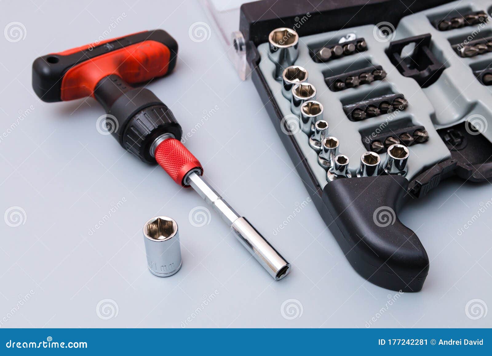 Adjustable Spanners Set with Red Holder Over a Grey Background. Father