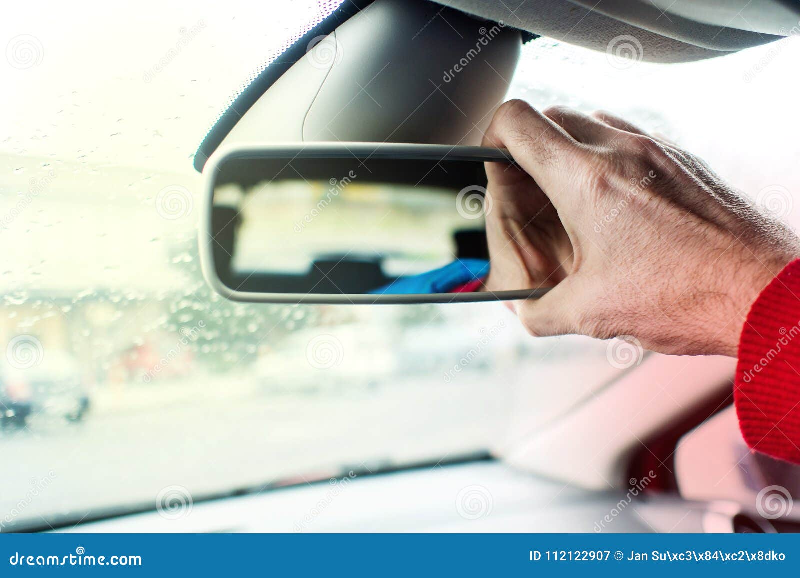 Adjusting Car`s Back Interior Mirror with Right Hand Stock Image