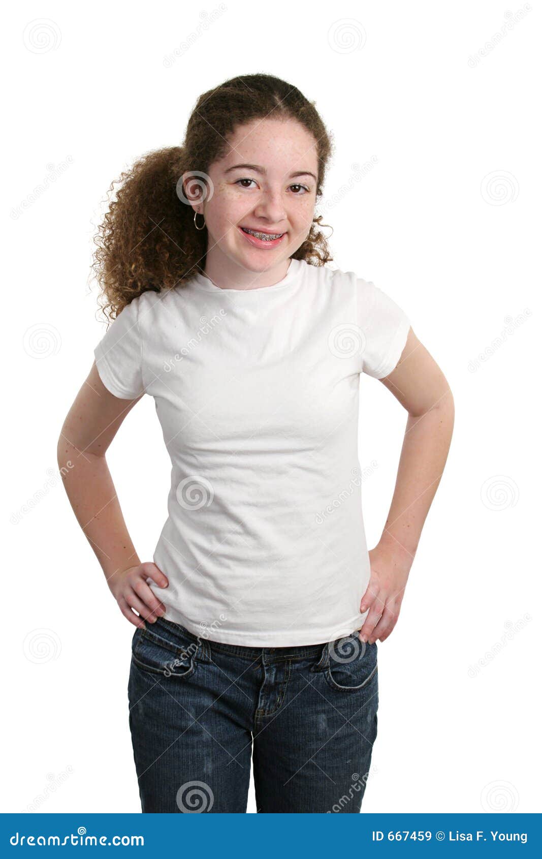 A casual teen girl modeling denim and a white t shirt 