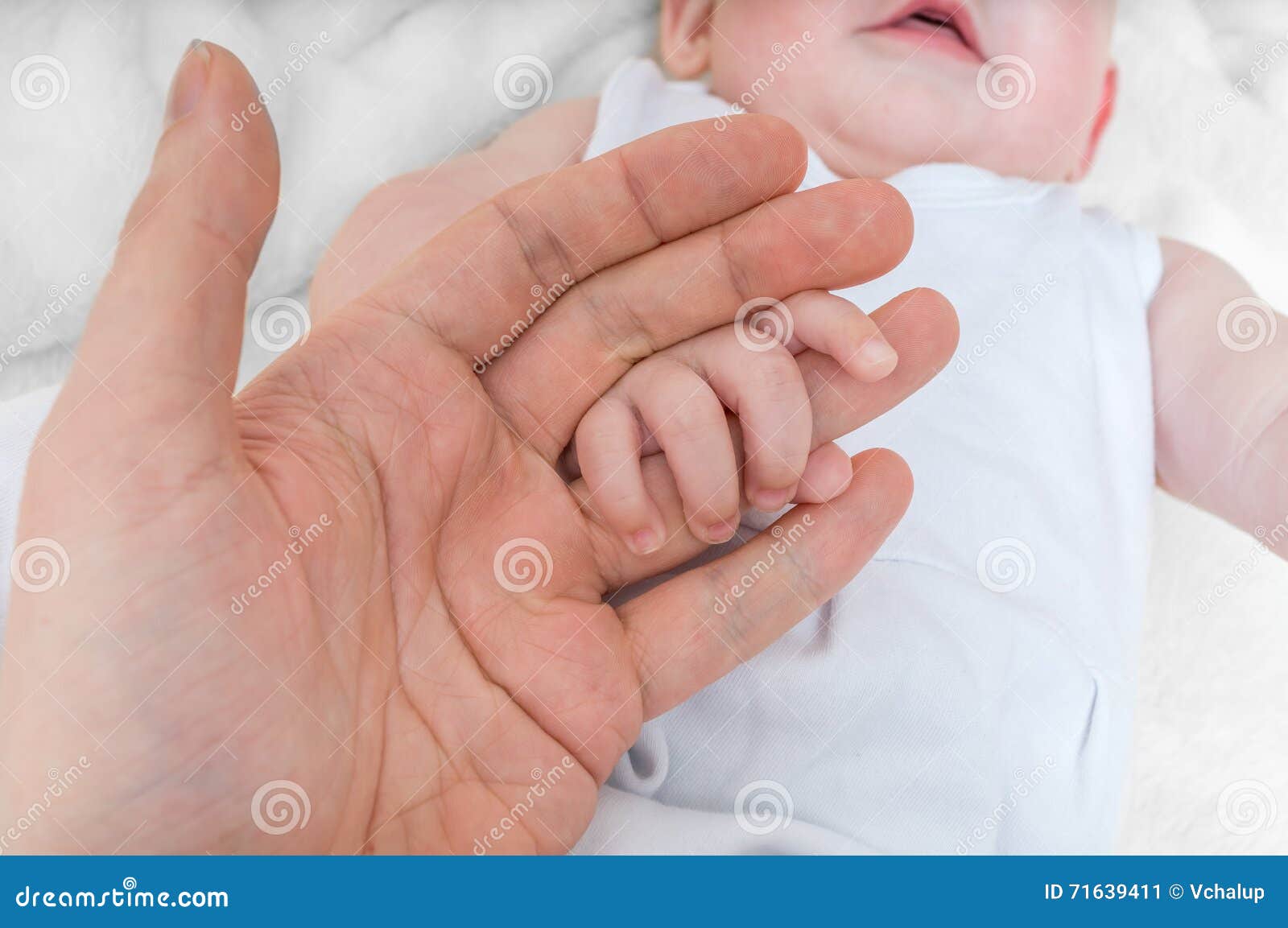 adoption baby concept. man holds little child's hand