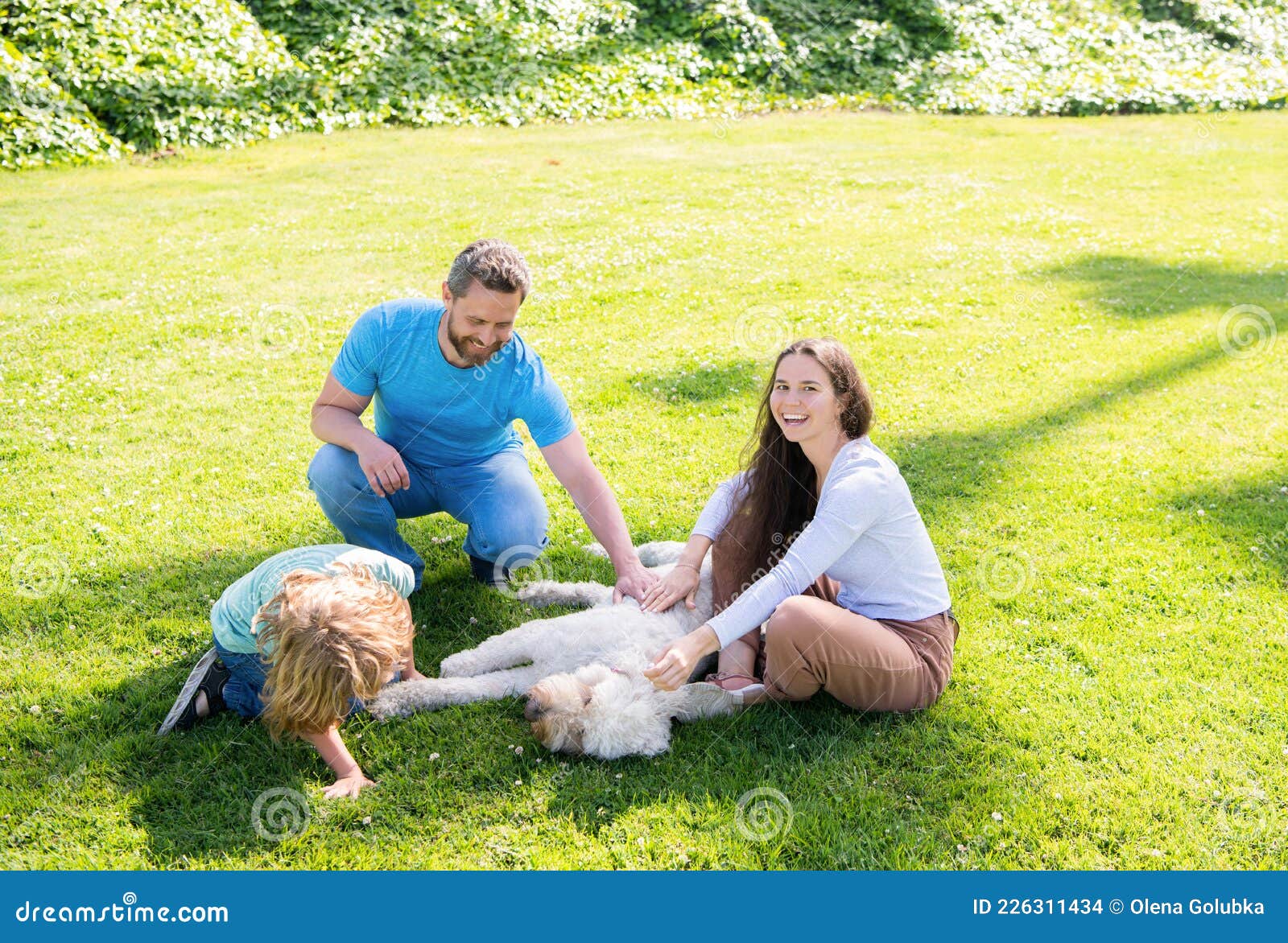 Adoption and Charity. Family Day. Friendship. Father Mother and Child on Green Park Grass. Stock Photo - Image of love: 226311434