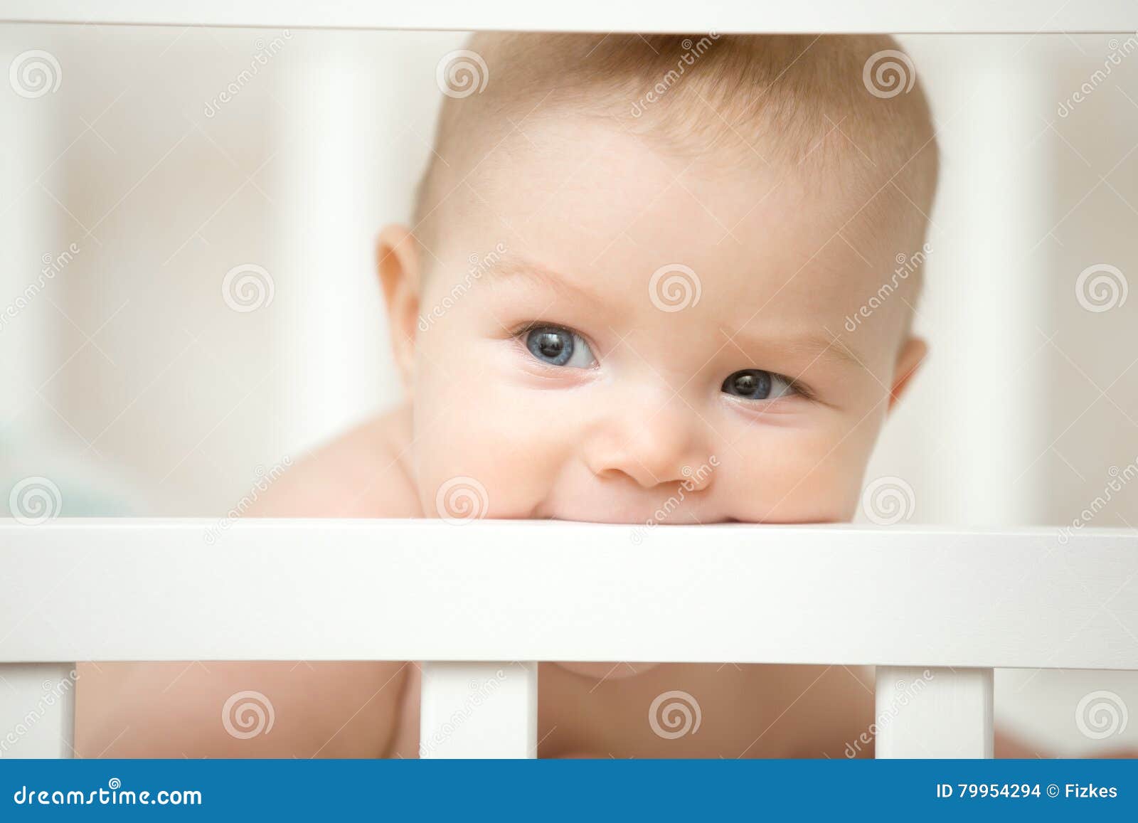 Adorable Baby Biting The Board Of His Wooden Cot Stock Photo Image Of