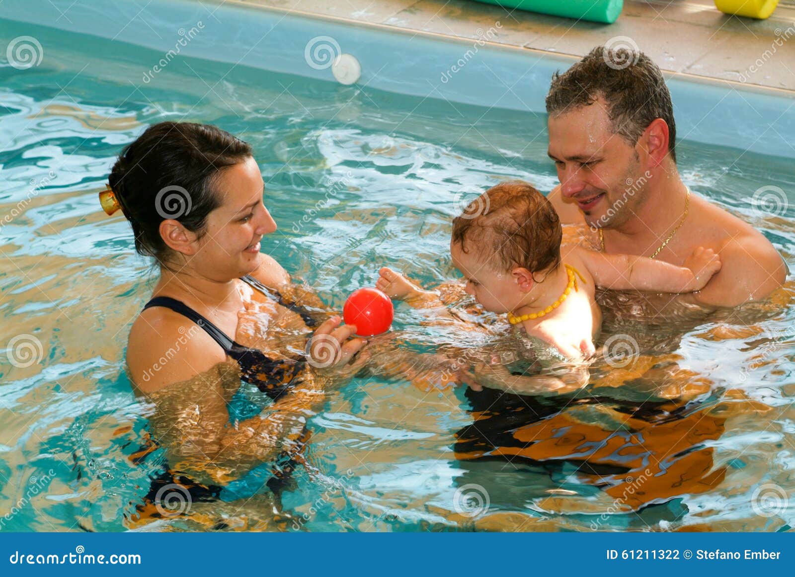 Adorable Baby Enjoying Swimming In A Pool With His Mother Editorial