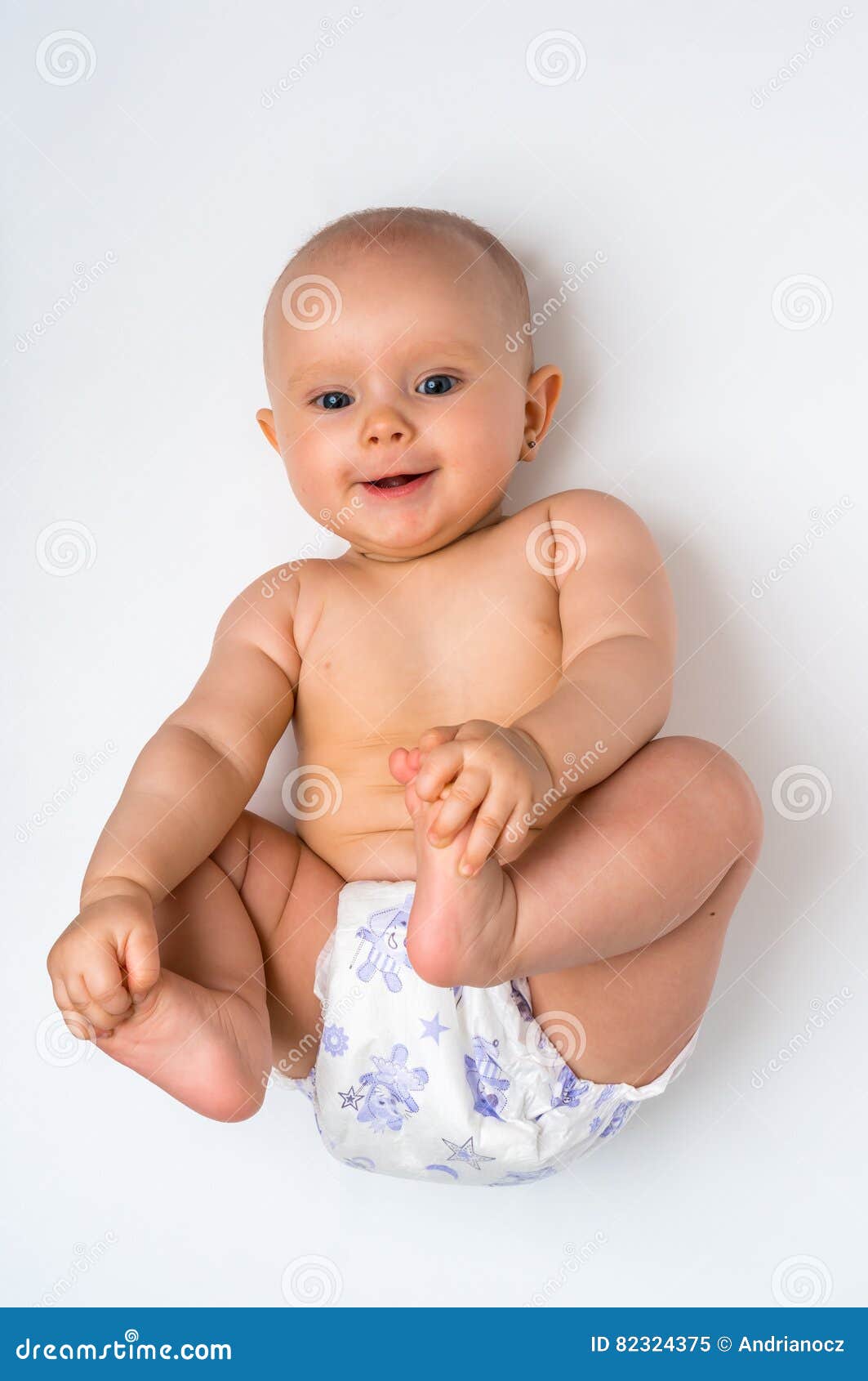 Adorable Baby Girl Lying On Back Isolated On White Stock Image