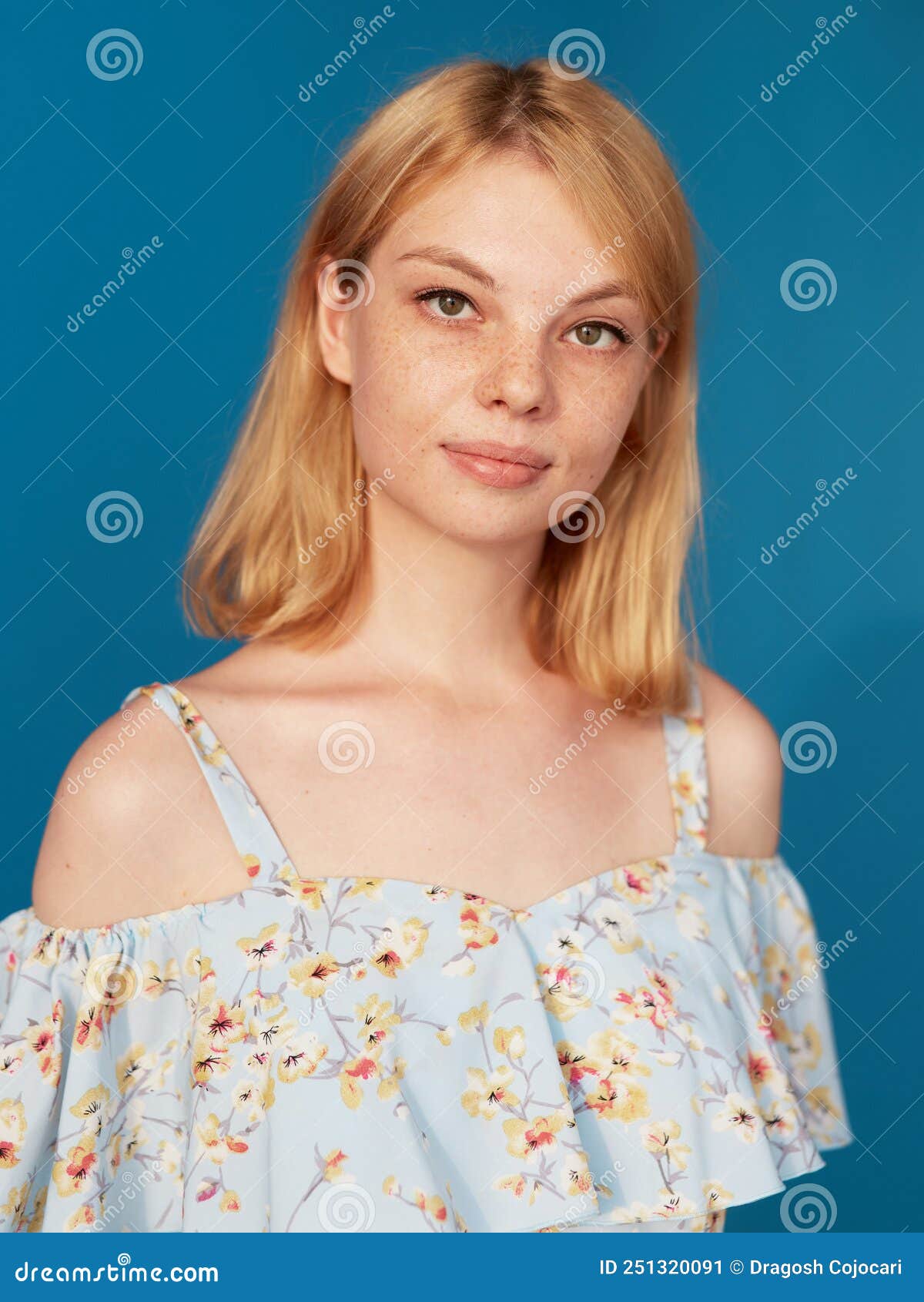 Adorable Blonde Young Woman With Blonde Hair Looking At Camera