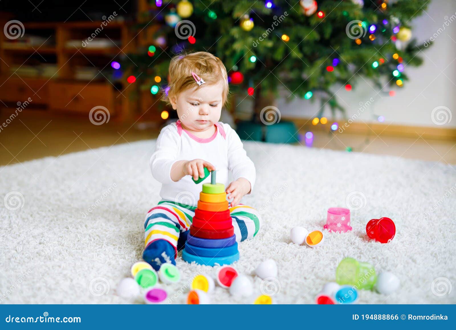 adorable cute beautiful little baby girl playing with educational toys at home or nursery. happy healthy child having