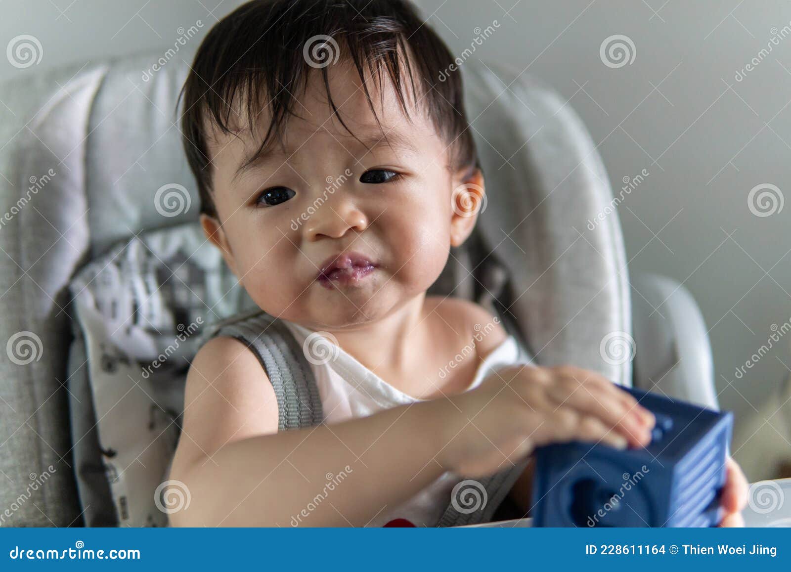 Happy Asian Chinese Baby Boy Siting on Baby Chair Enjoying His Lunch ...