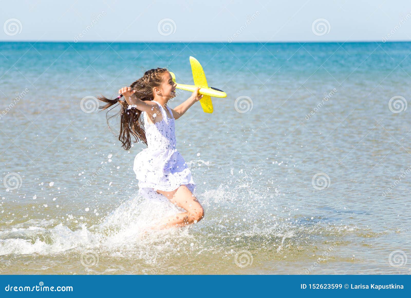 Naked girl running in water